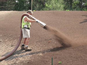 Adding compost to a construction site