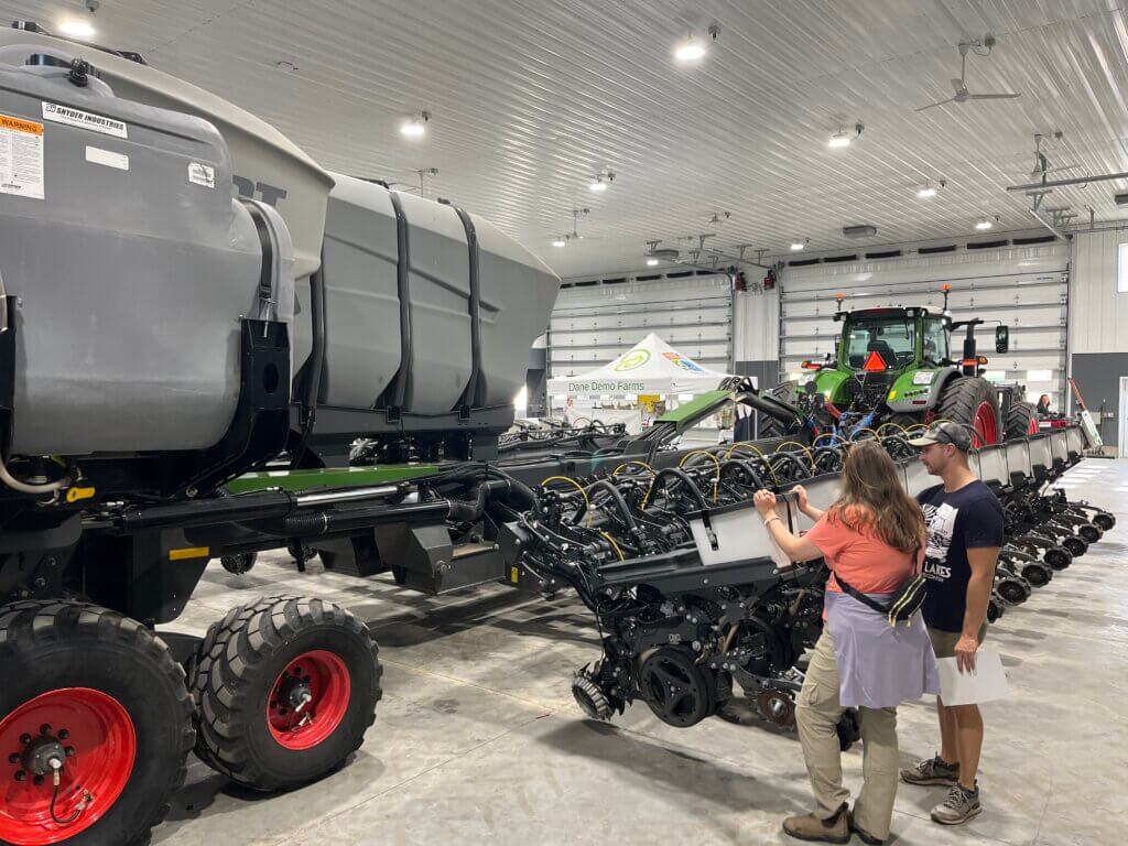 Touring the farm shop at the 2025 Yahara Pride Farms Twilight Meeting