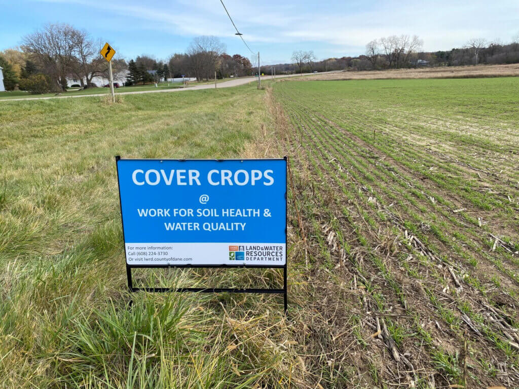 Cover crops sign on a local field. Photo courtesy Dane County Land & Water Resources.