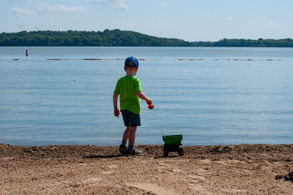 Boy plays at Governor Nelson State Park Beach, summer 2022