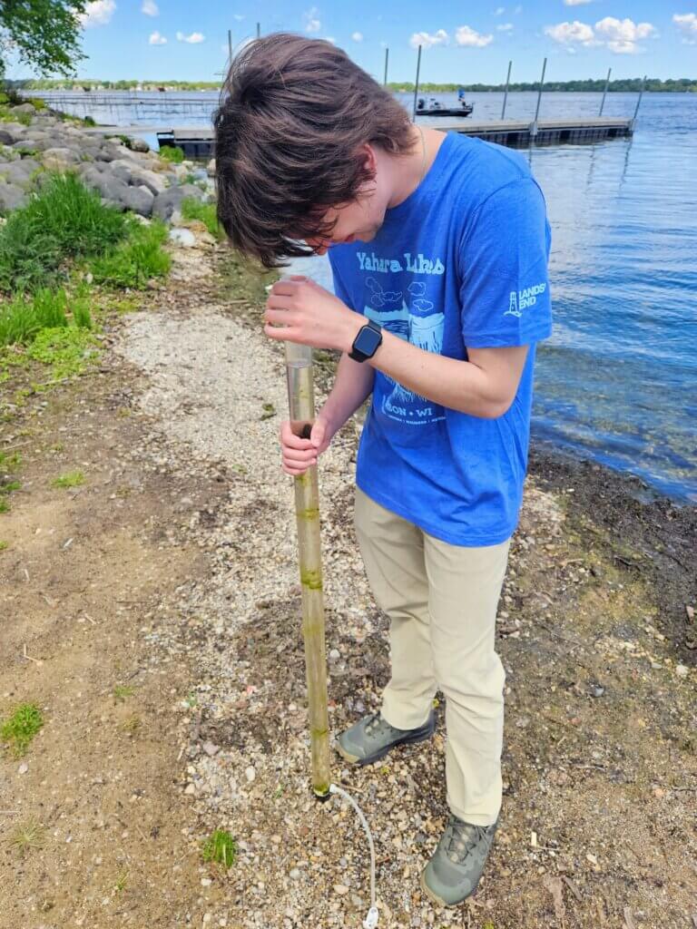 2024 Monitoring - intern collects water clarity reading