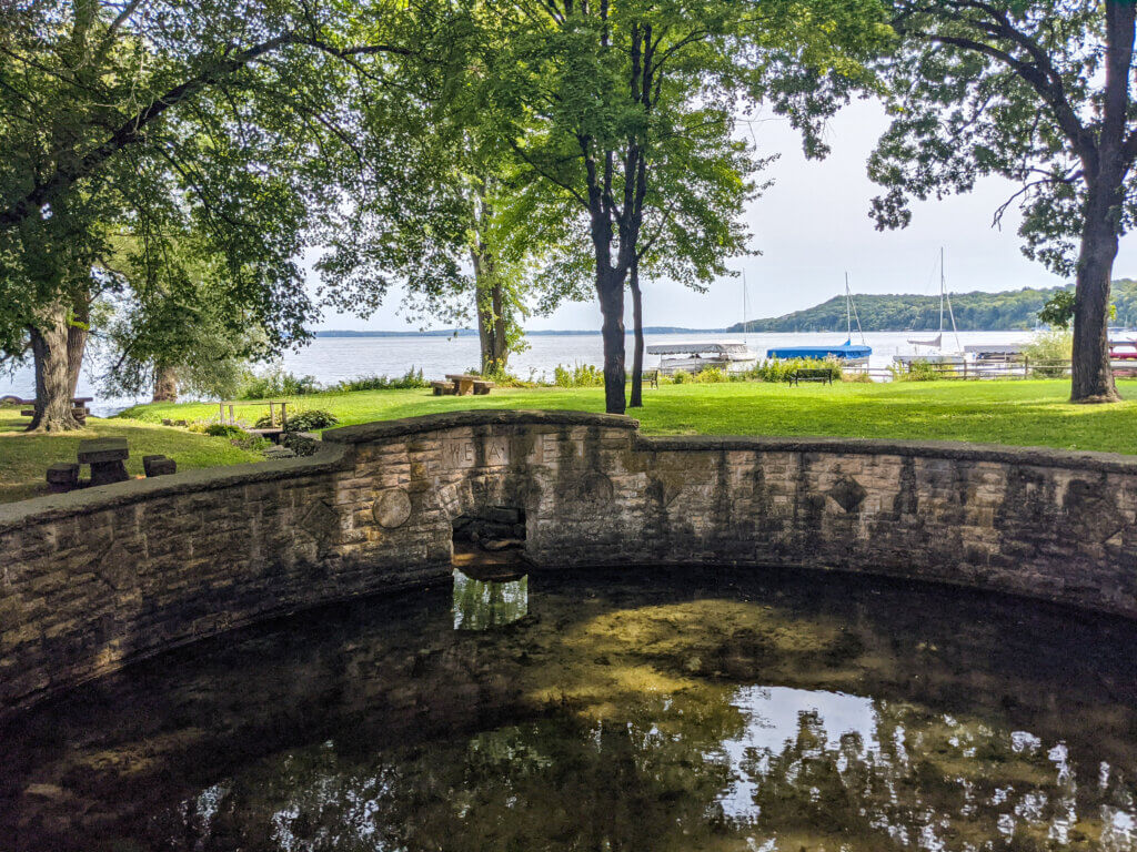 The springs at the site now known as Merrill Springs Park on Lake Mendota were once called Makamai by the Ho-Chunk. European settlers later renamed the area Merrill Springs after Alfred Merrill, a farmer who settled near Spring Harbor in the mid-1800s. Today, the historic lakefront park features a restored spring cistern and three stone benches constructed in 1934.